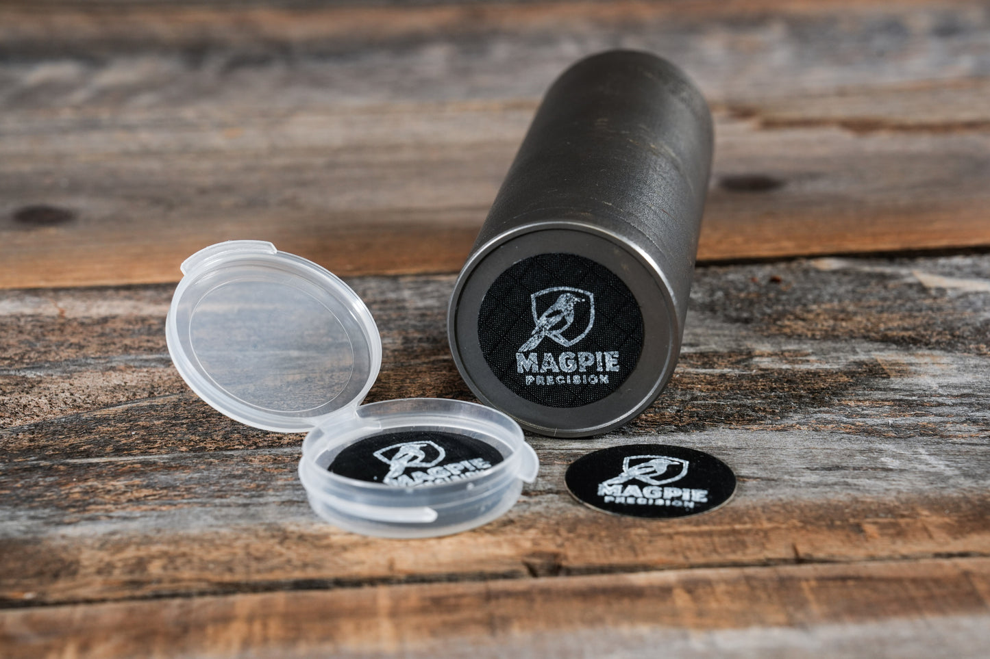 Magpie Suppressor Seal applied to a suppressor next to its travel case and extra seals