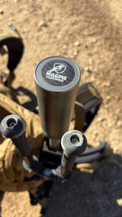 Close-up of the Magpie Precision logo laser-etched on a suppressor end cap
