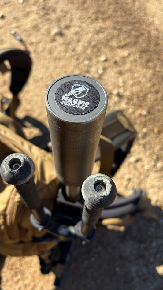 Close-up of the Magpie Precision logo laser-etched on a suppressor end cap