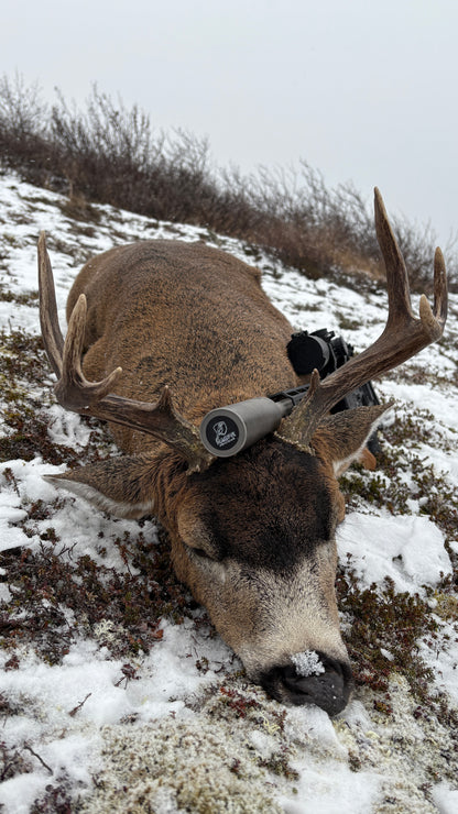Suppressor fitted with a Magpie Suppressor Seal on a mule deer harvested in the snow on a hill